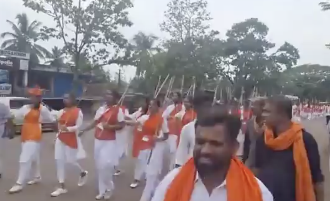 Durga Vahini member organize street march holding canes in Kasaragod