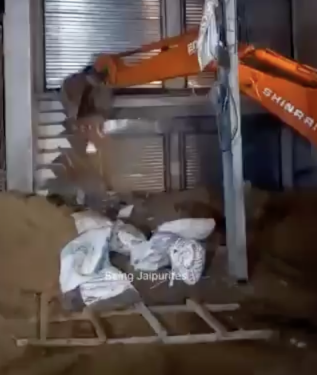 Authorities demolish structure after finding dead cow in basement