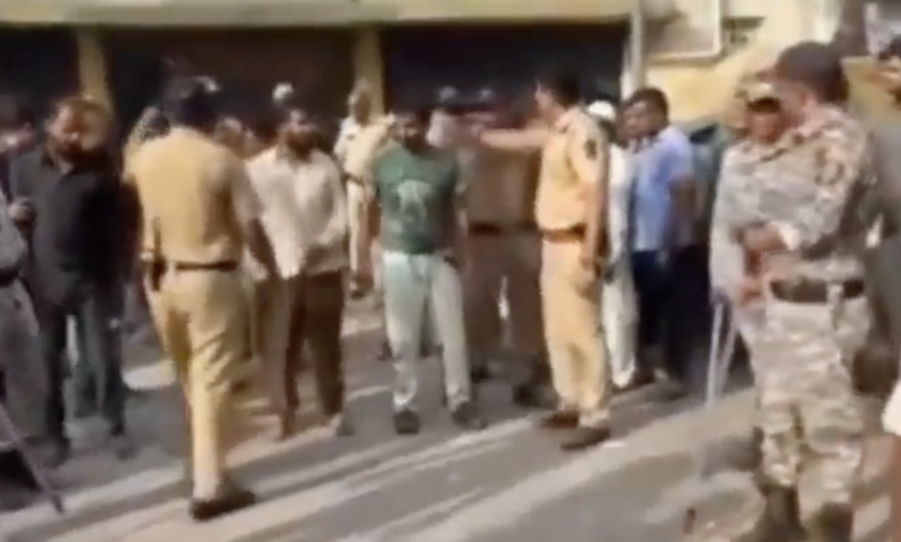 Police parades injured Muslim men around the town