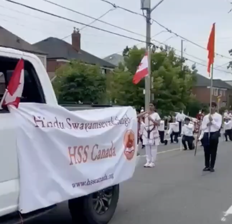 In Toronto, HSS Members March in Canada Day Parade Carrying Saffron Flag and Batons