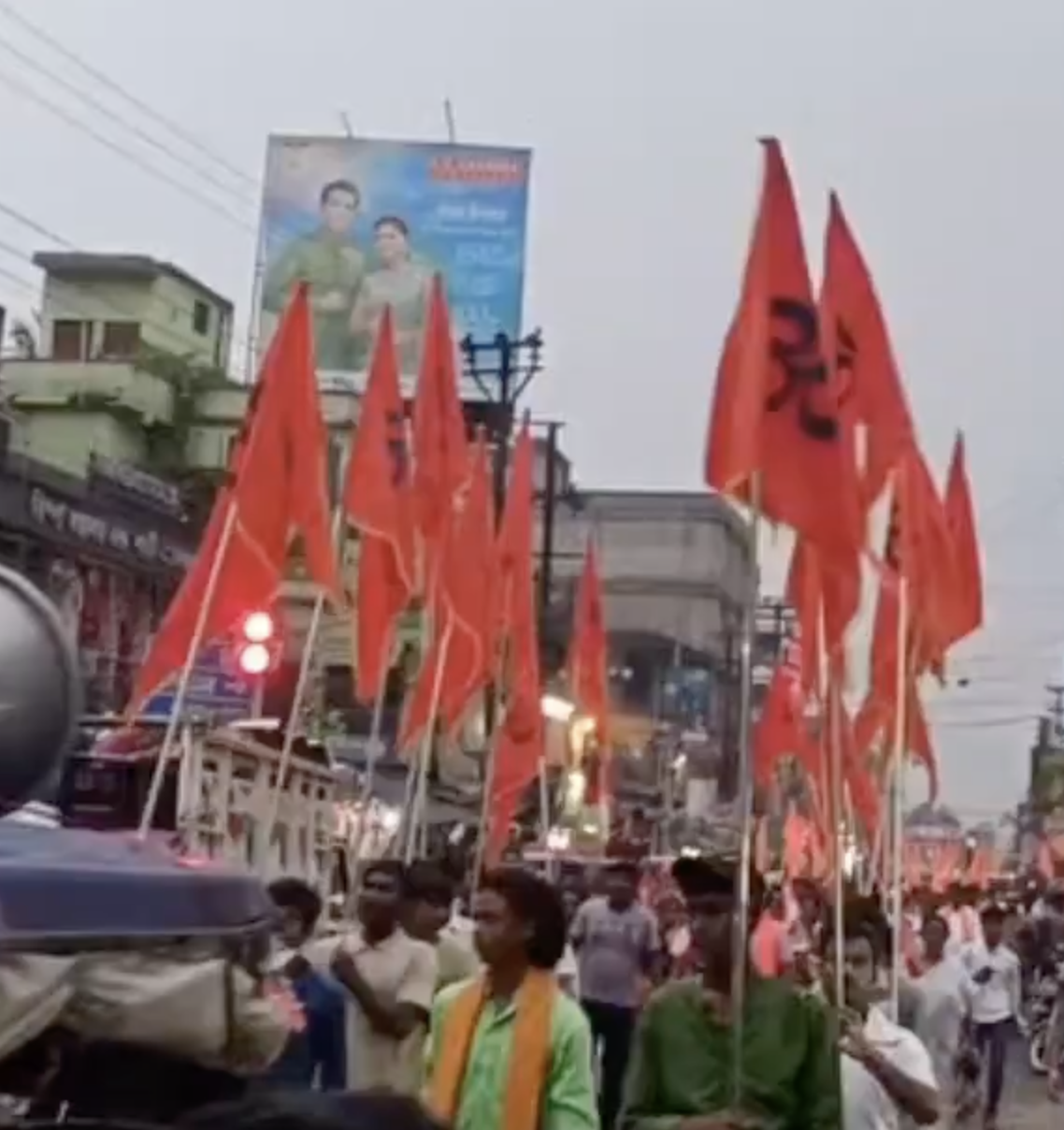 In Howrah, participants brandish swords during religious procession